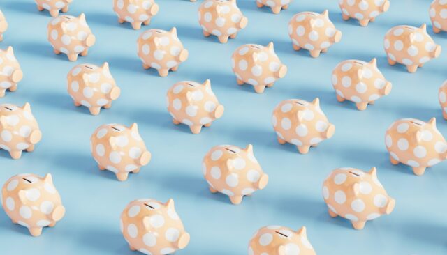 Rows of beige piggy banks with white polka dots on a light blue background, symbolizing savings and affordability, representing free professional website hosting